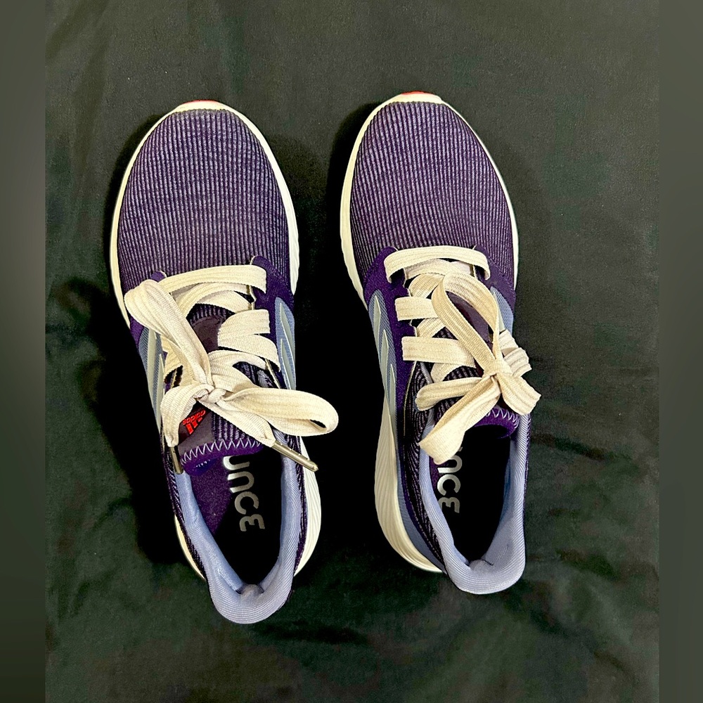 Adidas. Size 8.5 walking shoes. I wore them once. Ribbon shoelaces.